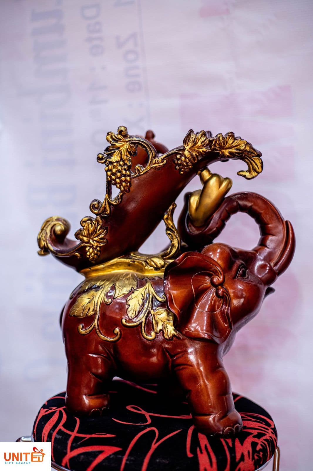 Ornate Golden-Accented Elephant Decorative Figurine with Wine Holder